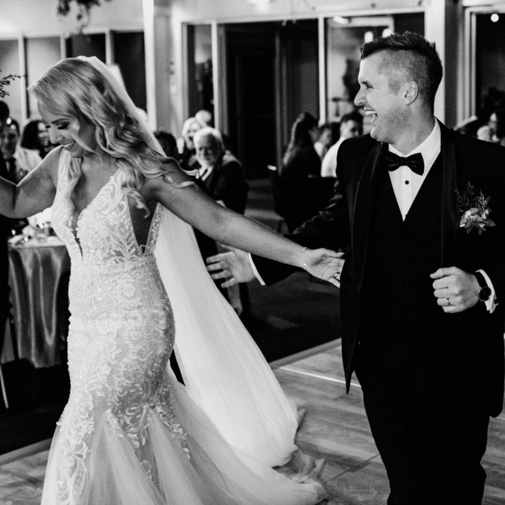 Bride and groom celebrating on the dance floor during their Melbourne Zoo wedding reception